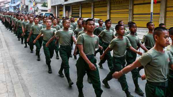 United Wa State Army (UWSA) soldiers march&nbsp;during a ceremony in Myanmar's&nbsp;Shan state&nbsp;in 2019. The group is&nbsp;a key player in the region bordering China.