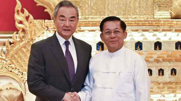 Chinese Foreign Minister Wang Yi, left, meets with Myanmar's military chief Min Aung Hlaing in Naypyitaw on Aug. 14.