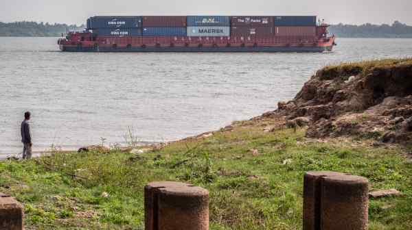 A ship transports containers down the Mekong River. Recently installed Cambodian PM Hun Manet said&nbsp;the $1.7 billion China-backed canal project would allow his country to "breathe through our own nose," diverting its goods for export directly to its own coast rather than via the Vietnam-controlled Mekong Delta. (Photo by Jack Brook)