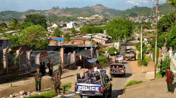 Army soldiers and police officers patrol in Lashio, Myanmar, in May 2013. The city, which is near the border with China, is one of the most important&nbsp;in&nbsp;northern Shan State for the Myanmar military.