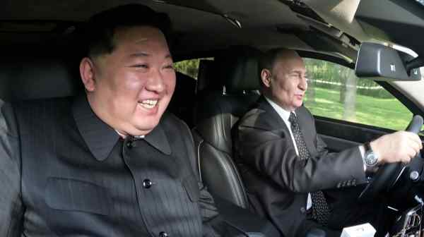 North Korean leader Kim Jong Un and Russian President Vladimir Putin ride in a car together in Pyongyang on June 19.&nbsp;(KCNA via Kyodo)