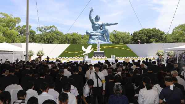 Attendees of a peace ceremony marking the 79th anniversary of the U.S. atomic bombing of Nagasaki hold a moment of silence in Nagasaki&nbsp;on Aug.&nbsp;9. (Pool photo)