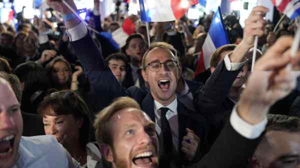 Supporters of the French far-right National Rally party react at the party's election-night headquarters on&nbsp;June 9&nbsp;in Paris.